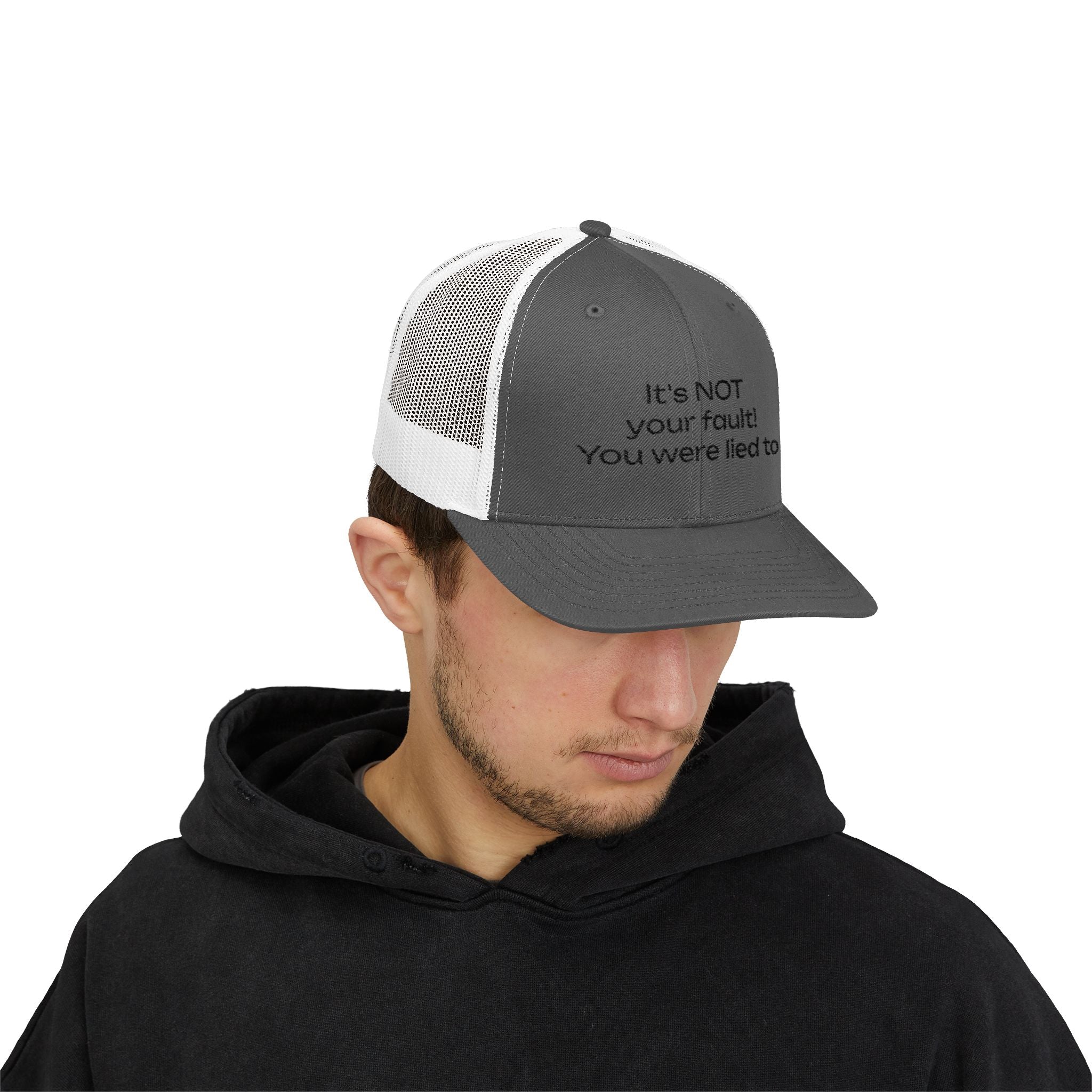 It's NOT Your Fault Trucker Cap — White Mesh Snapback with Reassuring Text