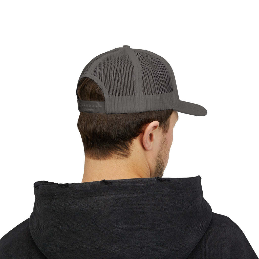 It's NOT Your Fault Trucker Cap — White Mesh Snapback with Reassuring Text