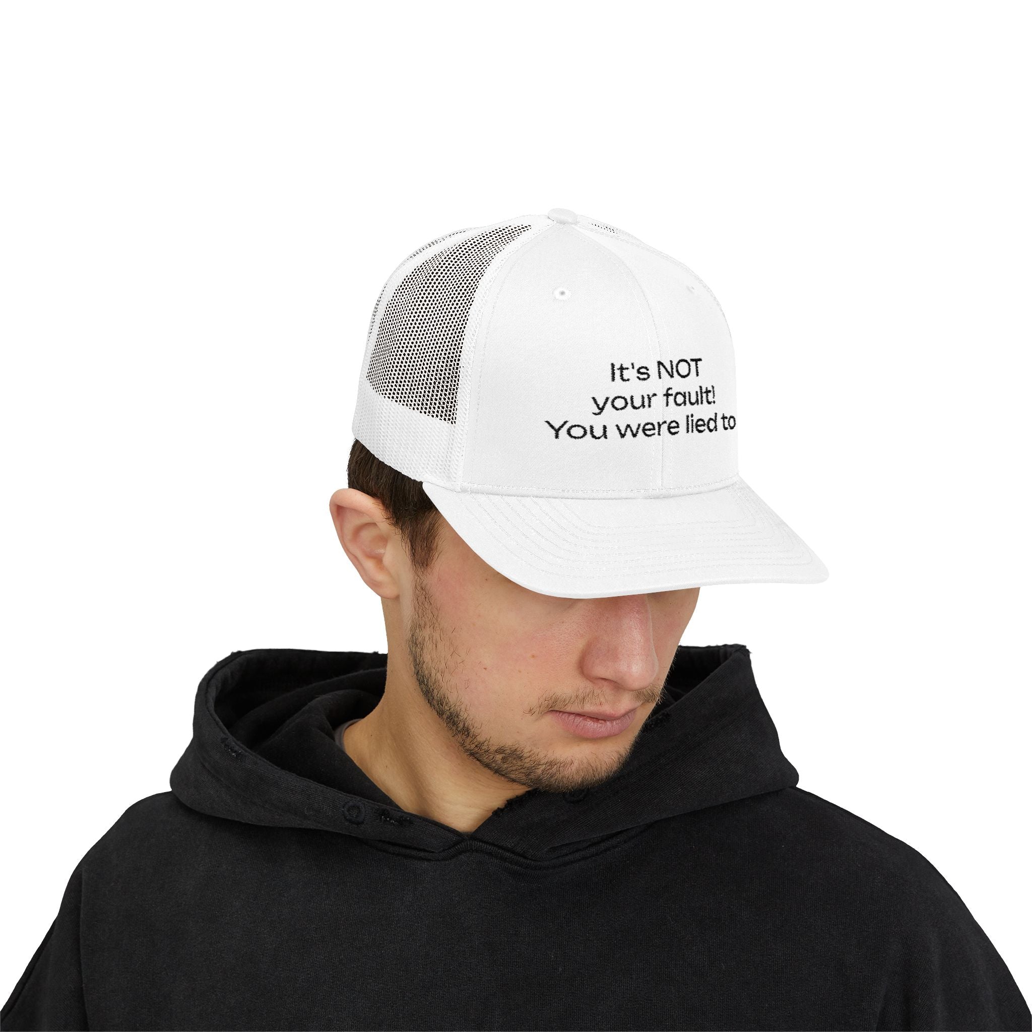 It's NOT Your Fault Trucker Cap — White Mesh Snapback with Reassuring Text
